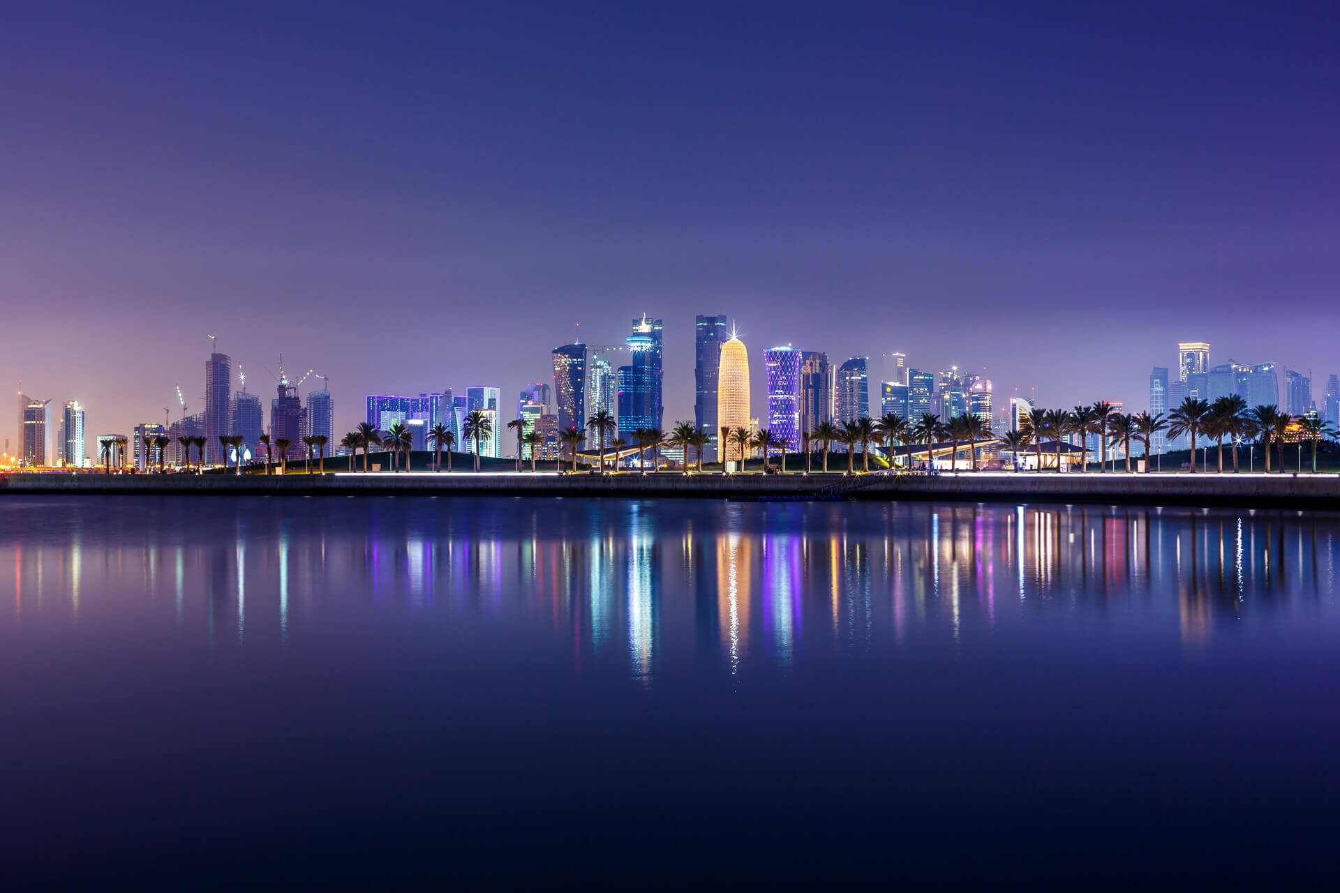 Doha city skyline at night in Qatar - Middle East
